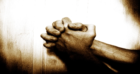 photo of hands clasped in prayer