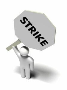 cartoon of person holding strike sign