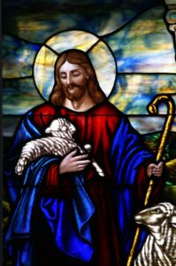 photo of stained glass window: Jesus holding a lamb