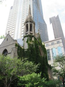 photo of a church with skyscraper in background