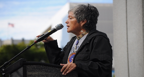 photo of indigenous woman speaking at rally