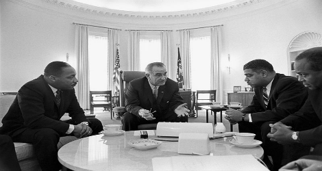 photo of civil rights leaders, including Dr. King, meeting with Lyndon Johnson