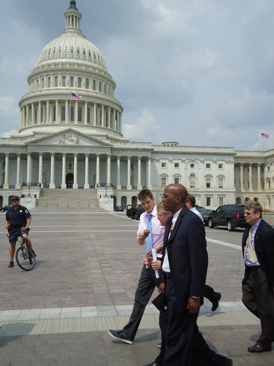 photo of J. Herbert Nelson walking in front of the Capital building