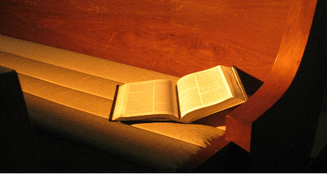 Bible in pew by Amy Burton