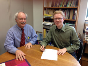 Rev. Dr. Chris Iosso (left) and Rev. Patrick Heery signing BSA letter