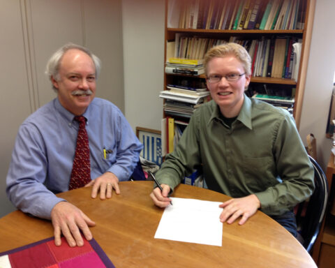 Rev. Dr. Chris Iosso (left) and Rev. Patrick Heery signing BSA letter