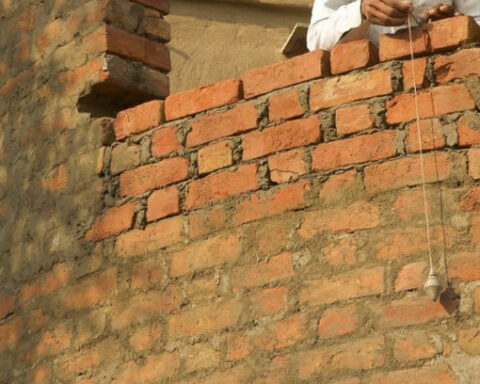 plumb line on a brick wall